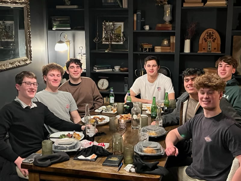 Theo with friends at dinner